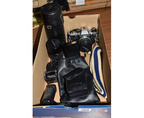 ONE BOX CONTAINING AN OLYMPUS OM10 CAMERA, to include an Olympus camera strap, an Olympus OM system 50mm lens, an Olympus 135