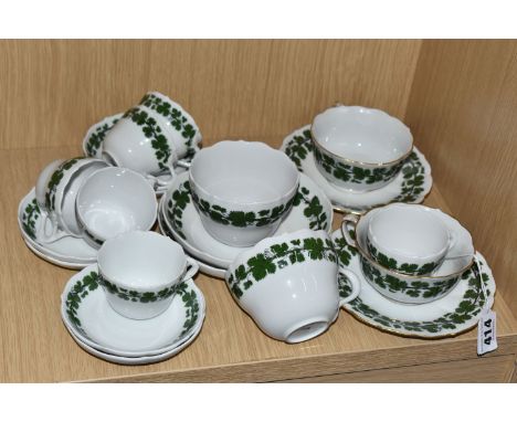A MEISSEN GREEN IVY PART TEA SET, comprising six small teacups and saucers, two larger cups and saucers with gilt rims, two c