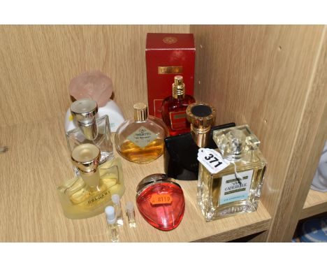 A COLLECTION OF USED FRAGRANCES AND EMPTY BOTTLES, comprising a partially full 100ml bottle of Carthusia Via Camerelle, a box