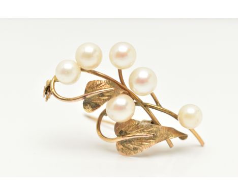 A YELLOW METAL CULTURED PEARL BROOCH, of a floral design set with six cultured pearls, stamped 14k, fitted with a brooch pin 
