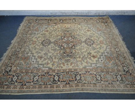 A LARGE RECTANGULAR RUG, with repeating geometric patterns, 271cm x 221cm, another rectangular rug, and a smaller Chinese woo