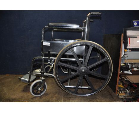 AN ARIMEDICAL WHEELCHAIR, with two footrests