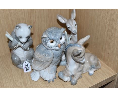 A LLADRO DEER AND FOUR NAO FIGURES comprising a Deer No. 1064, designed by Julio Fernandez, first issued in 1970 and retired 