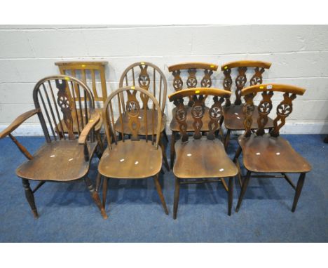 A SET OF FOUR ERCOL WINDSOR FLEUR DE LIS CHAIRS, another pair of Ercol chairs, a carver, and another chair (condition report: