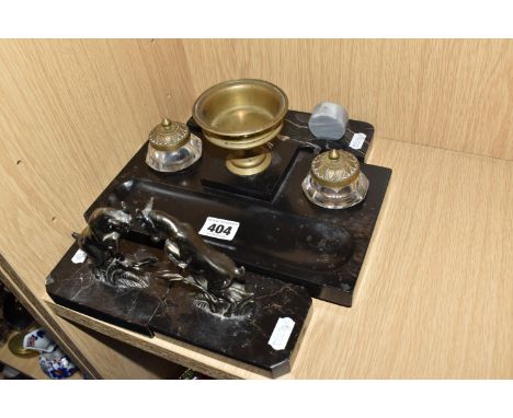 A PAIR OF FRENCH ART DECO BOOKENDS, A PHOTO FRAME, AND A MARBLE INK STAND, all mounted on black marble to include an inkstand