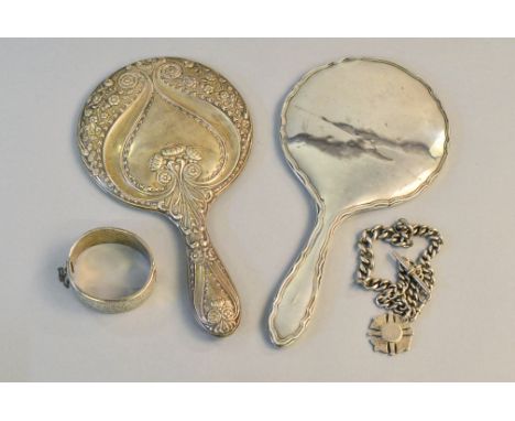 Two silver backed, H/M dressing table mirrors "A/F, both mirrors damaged", together with a silver H/M Bangle and a silver Alb