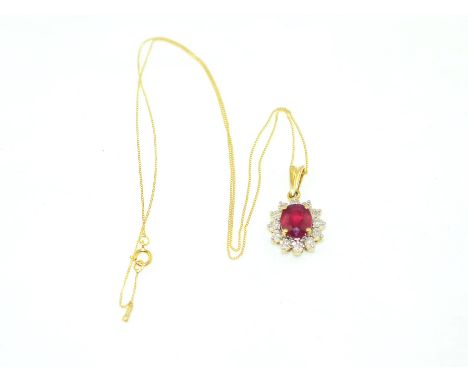 A 9ct H/M ruby and diamond cluster pendent, ruby approx 2.00ct, the illusion set diamond, total approx 0.12ct, suspended by a
