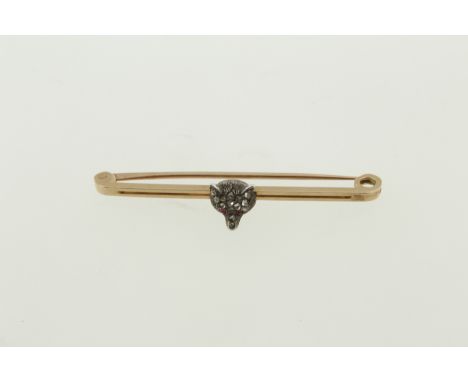 An early 20th century ruby & diamond set fox pin, tested 15ct, approx weight 2.9gms