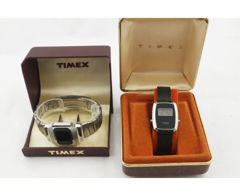 Two boxed TIMEX digital wristwatches