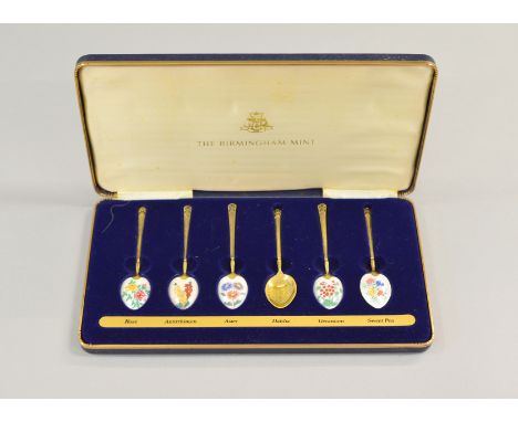 Six silver enamelled floral cased teaspoons by The Birmingham Mint, H/M B'ham 1979