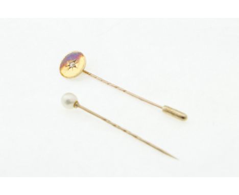 A diamond set stick pin, stamped 15ct, the old-cut diamond approx 0.05cts, approx weight 2.2gms, together with a 9ct H/M pear