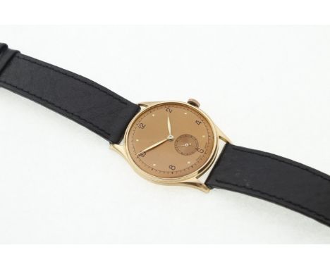 A gents unsigned manual-wind wristwatch, stamped 18k 0.750, on a black leather strap, lacking glass, working