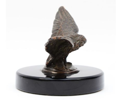 A vintage bronzed model of an eagle, wing span 17.5cm, mounted on a black glass base. (1 item)