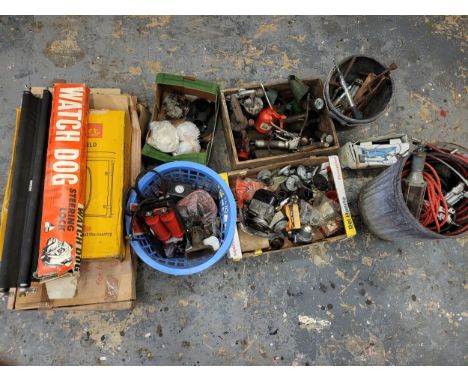 Tools and car spares, a large lot to include grease guns, oil cans, a magneto, a carburettor, airlines, car wind deflectors (