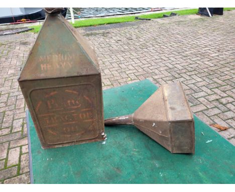 A Pratts Oil Can "Medium Heavy Tractor Oil" plus a BP embossed funnel. (2 items)