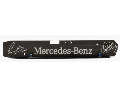 Lewis Hamilton/Mikka Hakkinen, a signed Mercedes Benz carbon fibre engine plate, 44 x 7cm, together with a 2007 ebay descript