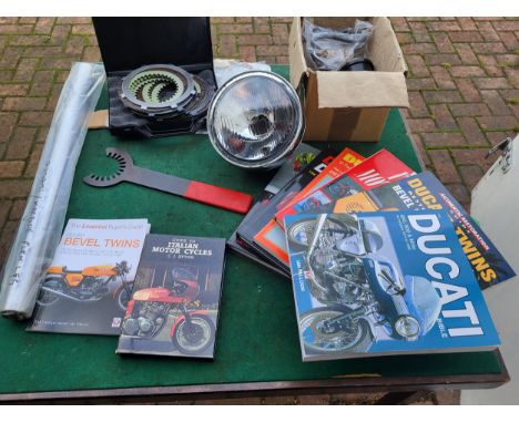 Ducati Items, including a Marzocchi fork leg, a clutch and tool, a selection of Ducati and Italian bike books. (1 box)