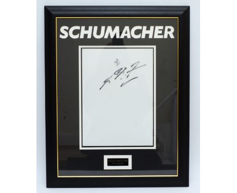 Michael Schumacher, a signed and mounted white Ferrari fabric panel, 61 x 48cm overall. (1 item)