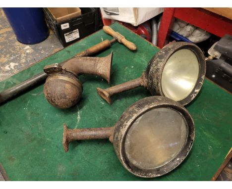 Two Vintage Car Headlamps, an electric car horn, a Dunlop No.2 stirrup pump. (4 items)