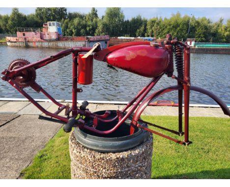A Bown motorcycle frame, and wheel, plus various sundry parts. c.1950. Designed to accept a 98cc Villiers two speed engine. N