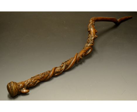 Folk Art - a 19th century gnarly wood root walking stick, the top carved as the head of a grotesque Ottoman wearing a feather