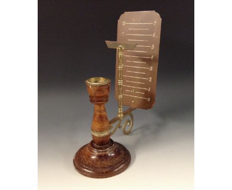 An unusual 19th century candle shadow clock, shaped rectangular copper register marked out with Roman and Arabic numerals, T-