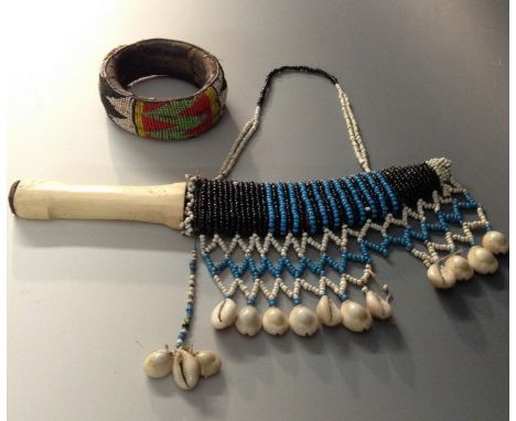 Tribal Art - an African beadwork bangle, probably Kenyan, 10cm diam; a dagger, possibly Sudanese, 17cm curved single-edged bl