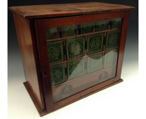 A Victorian mahogany chemist's shop display cabinet, by Ferris & Co Ltd., Bristol, glazed door enclosing an arrangement of ti