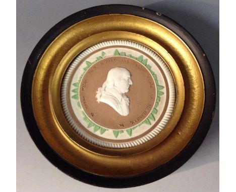 A 19th century jasper ware portrait roundel of William Ward, 3rd Viscount Dudley and Ward (1750-1823), wearing periwig, crava