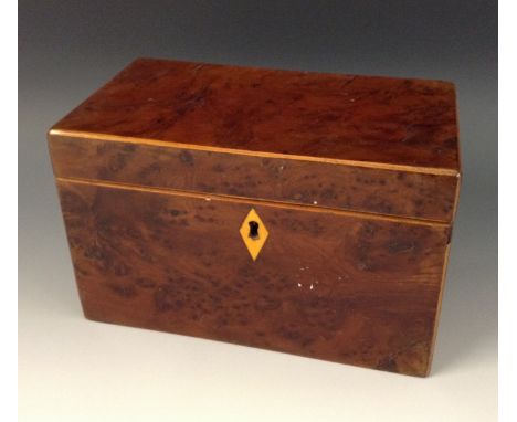 A George III burr yew rectangular tea caddy, hinged cover enclosing twin compartments, outlined throughout with boxwood strin