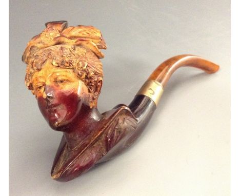 A 19th century meerschaum novelty pipe, the bowl carved as the head of a lady of fashion, 17.5cm long, c.1890, cased