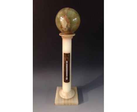 An early 20th century onyx columnar library thermometer, brass register, globe cresting, square base, 35cm high 