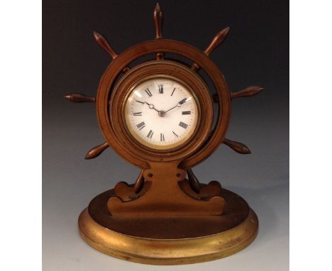 A late 19th century gilt brass novelty desk timepiece, as a ship's wheel, 6cm enamel dial inscribed with Roman numerals, 8-da