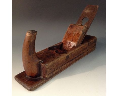 Tools - a 19th century wood plane, curved handle, heart shaped mouth, I Sorby cast steel blade, 26cm long 