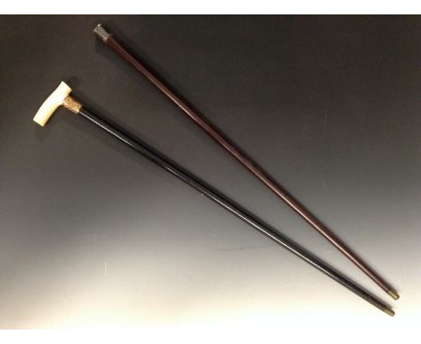 A Victorian ivory and ebony walking stick, crook-type handle, chased gold plated ferule, brass tip, 91cm long, c. 1890; a lat