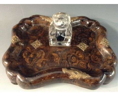 A Victorian faux walnut shaped oval inkstand, clear glass inkwell, the base scumbled overall and applied with engraved brass 