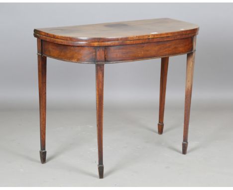 A George IV mahogany fold-over card table, raised on square tapering legs and spade feet, height 72cm, width 91cm, depth 45cm
