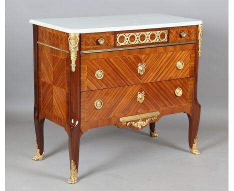 An early 20th century French Transitional style kingwood and gilt metal mounted three-drawer commode, the white marble top ab