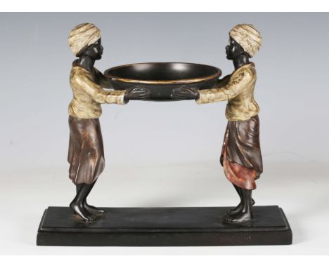 A 20th century cold painted cast bronze figural tazza, modelled as two standing boys supporting a central bowl, width 27.5cm.