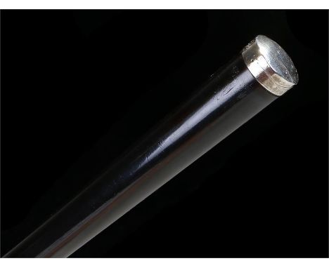 Ebony walking stick with white metal top and steel ferrule, with initials to the top. Length 89cm