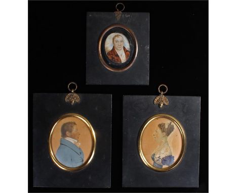 Two portrait miniatures of a gentleman and a lady, the gentleman wearing a blue coat and white stock; the lady with a blue dr