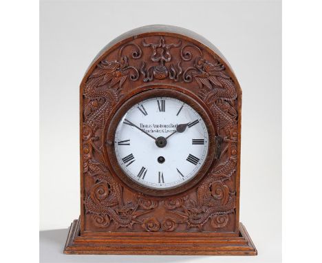 Unusual oak mantel clock, the signed white dial Thomas Armstrong & Brother, Manchester and Liverpool, with Roman hours, house
