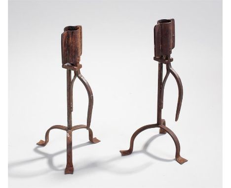 Two iron tripod leg candlesticks with sprung loaded sockets height 33.5cm 