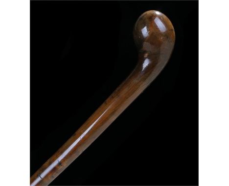 Walnut walking stick, in one piece with knob handle. Length 90cm