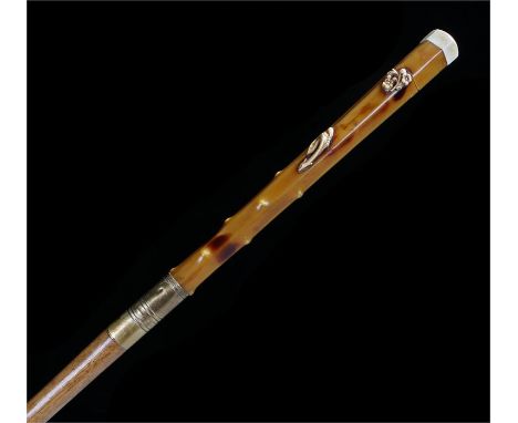 Japanese walking stick with hexagon handle, the top with an enamel petal decoration leading to a lacquered handle with relief