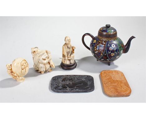 Japanese objects, to include two large early 20th Century netsuke, a carved bone figure with sword, two carved panels and a c