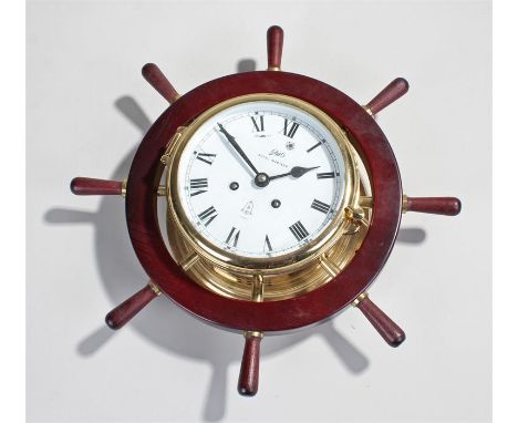 Schatz Royal Mariner ships type clock, the signed white enamel dial with twin train movement held within a ships wheel frame,
