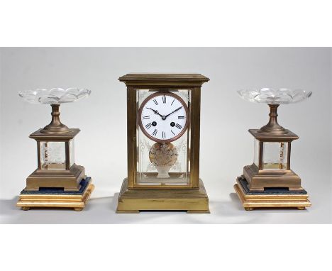 Victorian four glass mantel clock and garniture, the etched glass case with a white enamel dial and Roman hours, twin train m