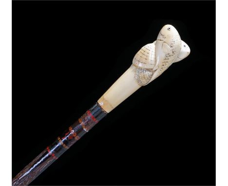 Victorian Japanese ivory handled stick, the handle carved as two fish and seashells, the shaft with two cloisonne bands of de