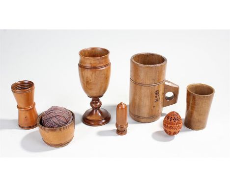 Collection of treen - side handled beechwood measure, wool bowl, sycamore beaker, boxwood dice shaker, fruitwood goblet, boxe